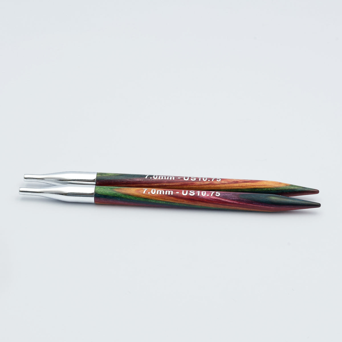Knitpro-symfonie-2-interchangeable-needle-tips-special-13cm - woooden 7.0mm circular knitting needles with metallic silver tips and colorful marbled handles in green, orange, and red, shown on a light gray background.